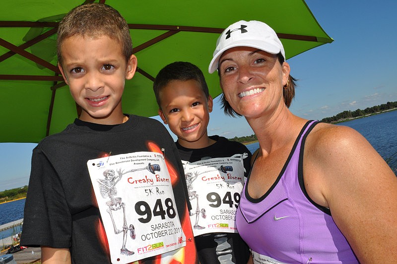 Clay and Dylan Brown got some help with their race numbers from their mother, Joann.