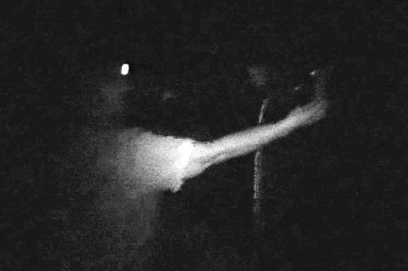 Maggie Sumney uses an EMF detector to search for a ghostly presence at The Players Theatre. Photo illustration by Rachel S. O'Hara