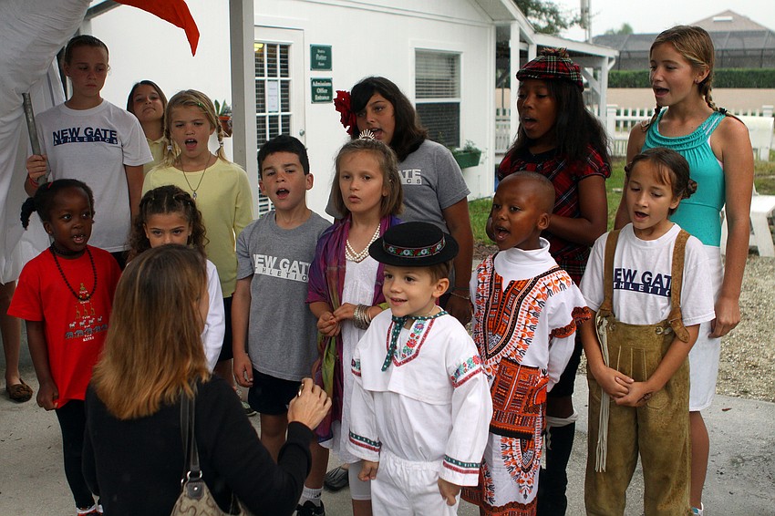 Some of the NewGate students sang the â€œStar Spangled Bannerâ€ to start off the International Children's Day events.