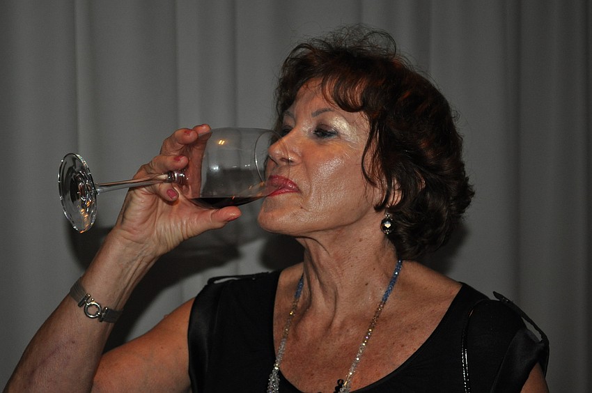 Barbara Dziedziech samples her wine.