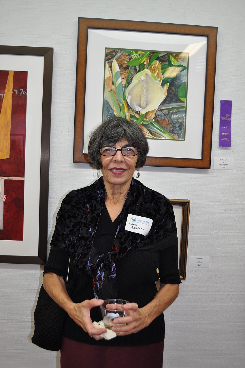 Longboat Key artist Marie Garafano in front of her piece 