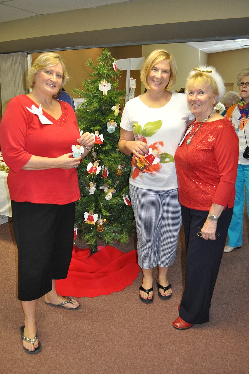 Co-Chairs of the event Jan Herman and Valarie Evanko stand with Event Coordinator Sue Reese.