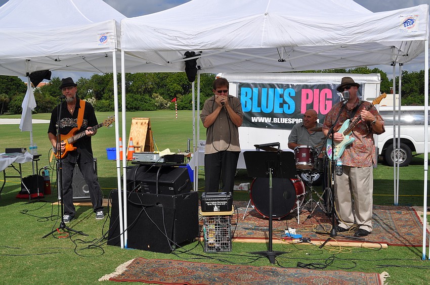 Blues Pig provided entertainment. Bass player Jim Linkogle, harmonica player Steve Scott, drummer Brad Tripp and frontman Stephen Mislyan.