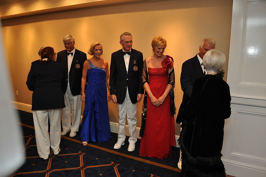 Marilyn and David Powell, Marie and new Commodore Bob Hunter, and Carlene and Former Commodore Bob Baime receive the new members