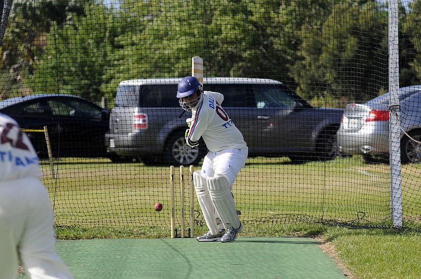 Batsman Dalip Madnani warms up in the practice net before his team takes the field.