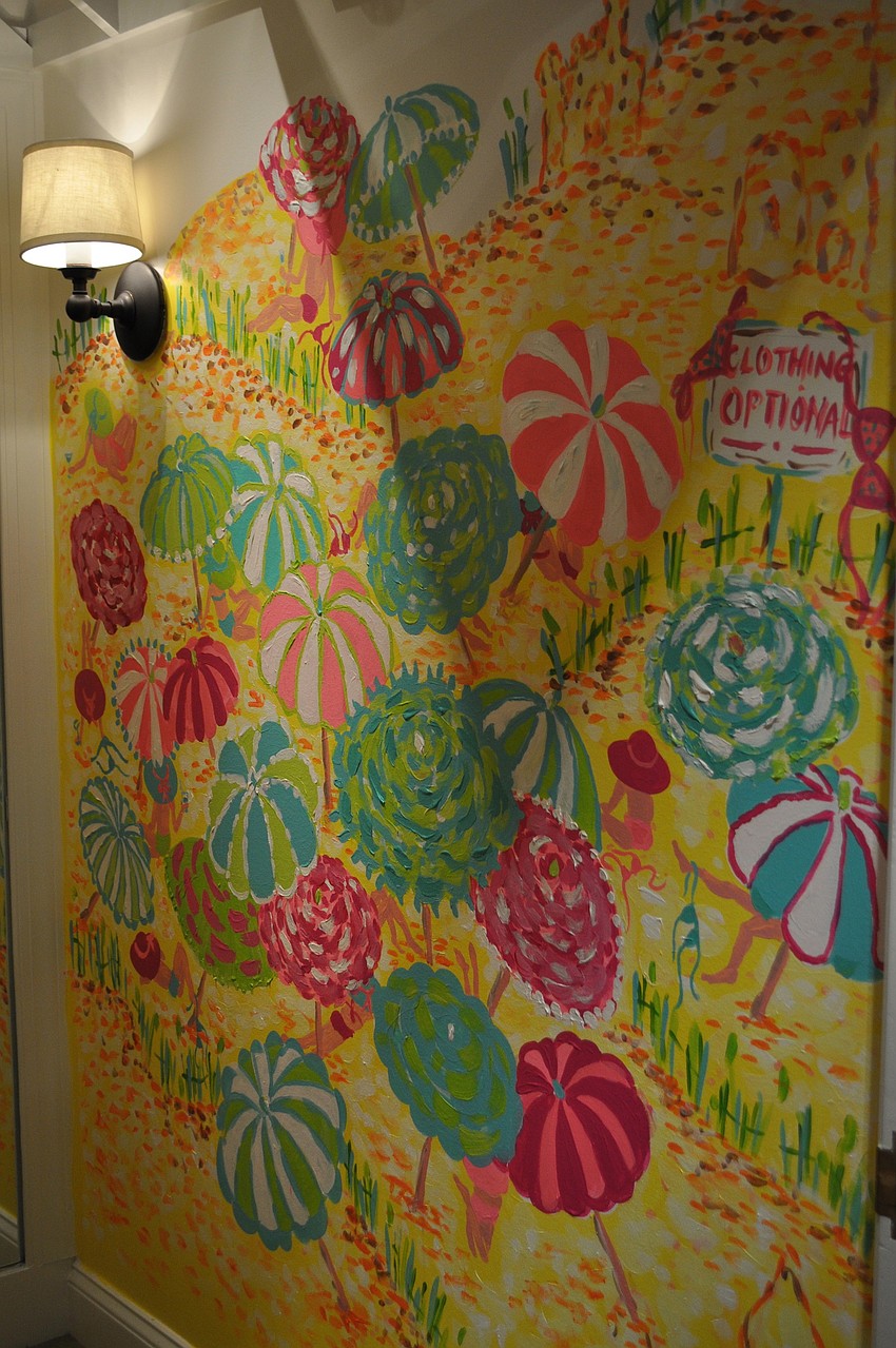 This dressing room was designed with walls painted with beach umbrellas.