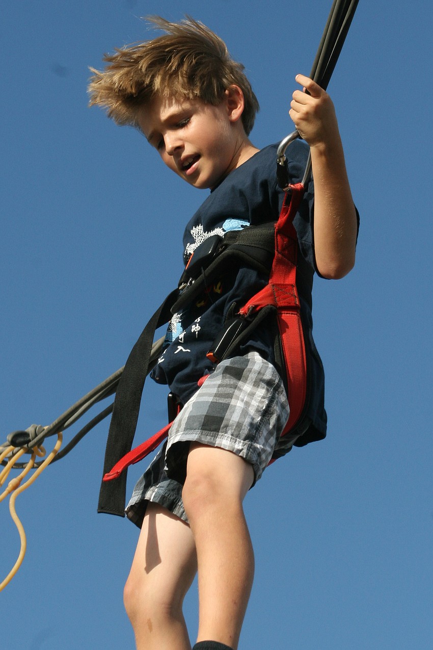 Christopher Short, 9, caught big air on this bungee jump attraction.