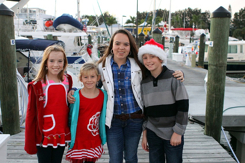 Katie, 11, and Emily, 8, Ridenour pose with Caroline, 13, and Patrick, 11, Kenefick