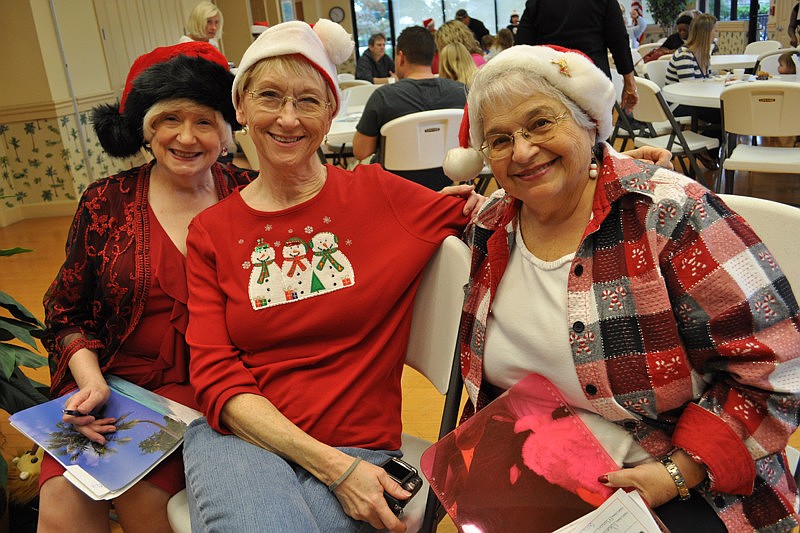 Sheri Miller, Nancy Lively and Jenny Magarelli helped with Santa photos.