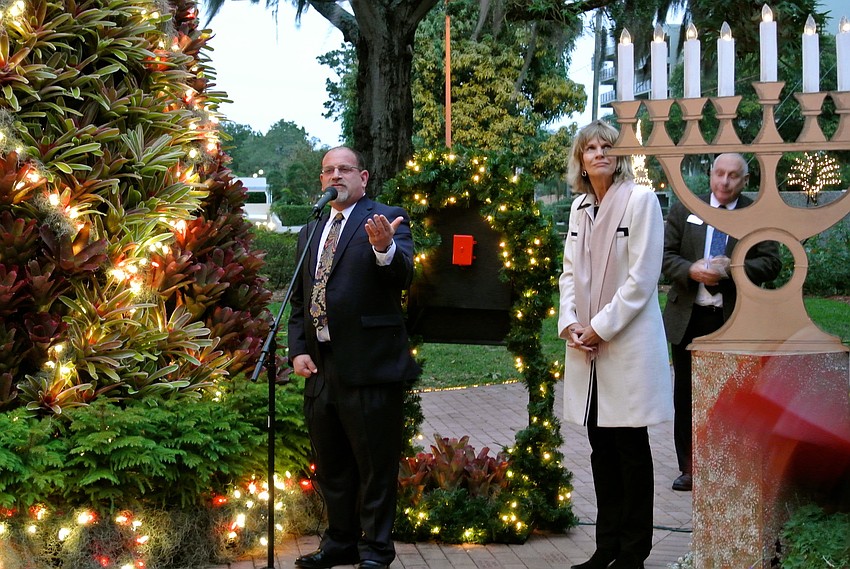 Martin Haberer, associate executive director of The Jewish Federation of Sarasota-Manatee, and Sarasota Mayor Suzanne Atwell spoke during the tree lighting.