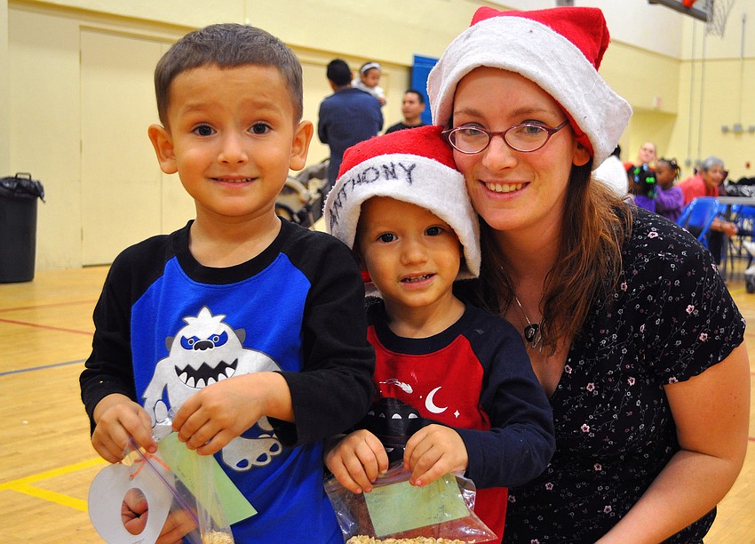 Jovani, 3, and Loretto, 2, Gonzalez with Marian Carson