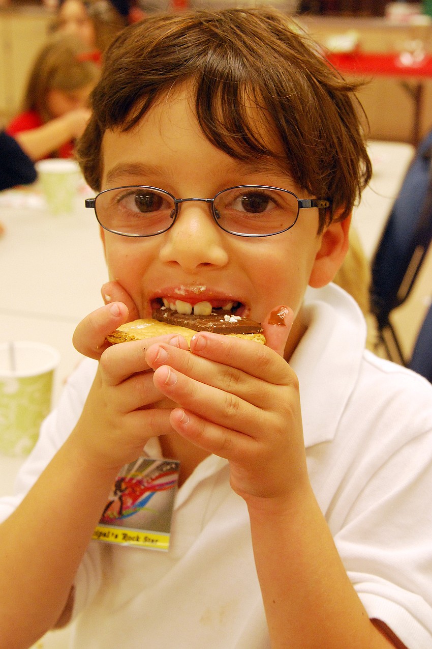 Blake Bernstein munched on a cookie at the party.