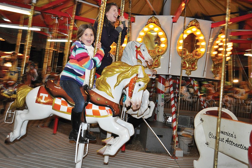 Five-year-old Brook Strickland, front, rode the carousel with her cousin, Hope Kennedy, at the 2011 Manatee County Fair. Published Jan. 20, 2011.