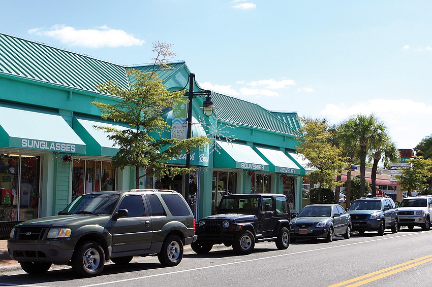 Siesta Key Village Association members questioned whether electric car owners willingly would give up their parking spots after charging their vehicles during season, if the Village installed a charging station.