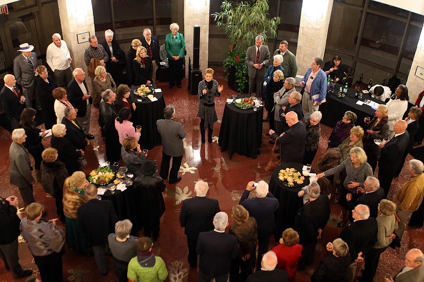Debra Lowe, center, speaks to fellow Rotarians, Tuesday, Jan. 3, inside the FCCI Rostunda at USF Sarasota-Manatee.