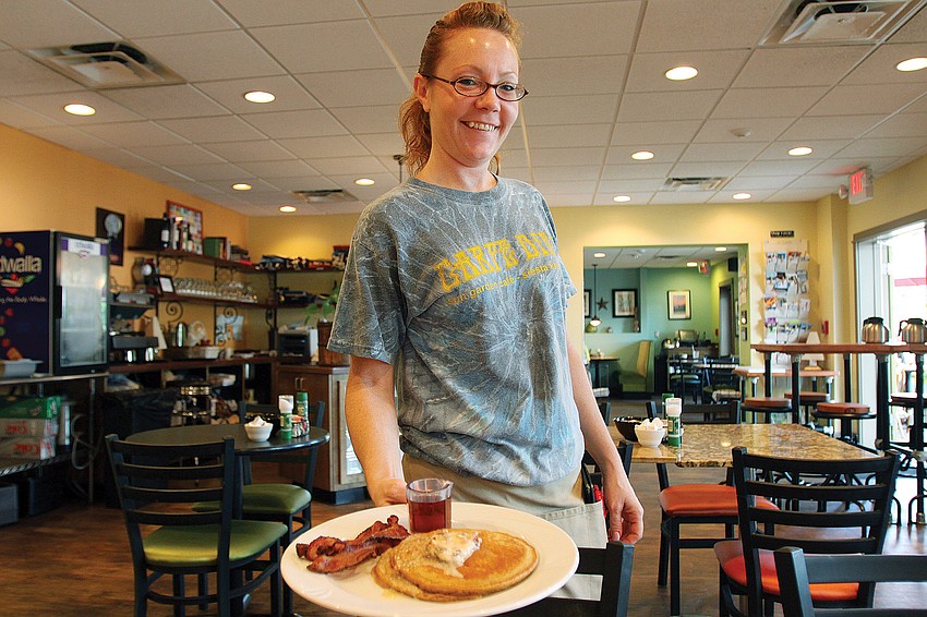 Kim Bard, a waitress for three years at the Sun Garden CafÃ©, on Siesta Key, has 18 years of waitressing experience. 