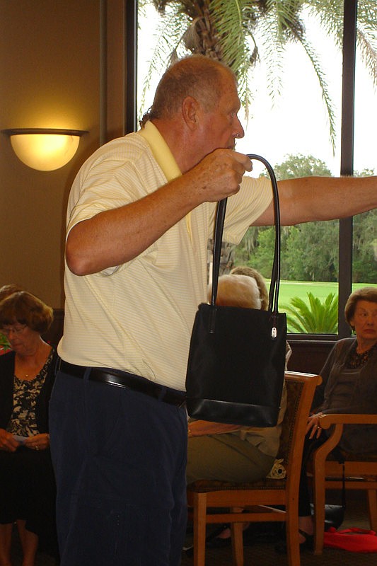 Curly Jamesen, auctioneer, kept bidding lively and full of humor.