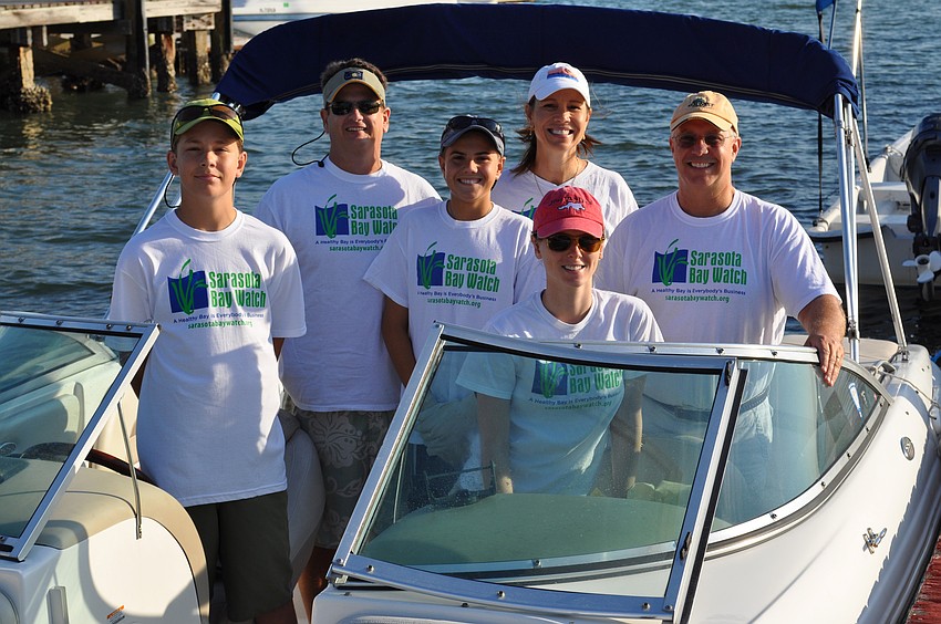Peter Kosub, Clay Jordan, Zack Jordan, Samantha Jones, Yvonne Jordan and Larry Stults took a boat to Siesta Key to help clean up.
