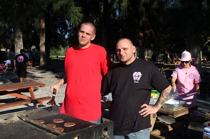 Terry Barfield and Pat Sciacca cooked hotdogs and hamburgers for the firefighters and the public Tuesday, Oct. 4 out at Siesta Key Beach.