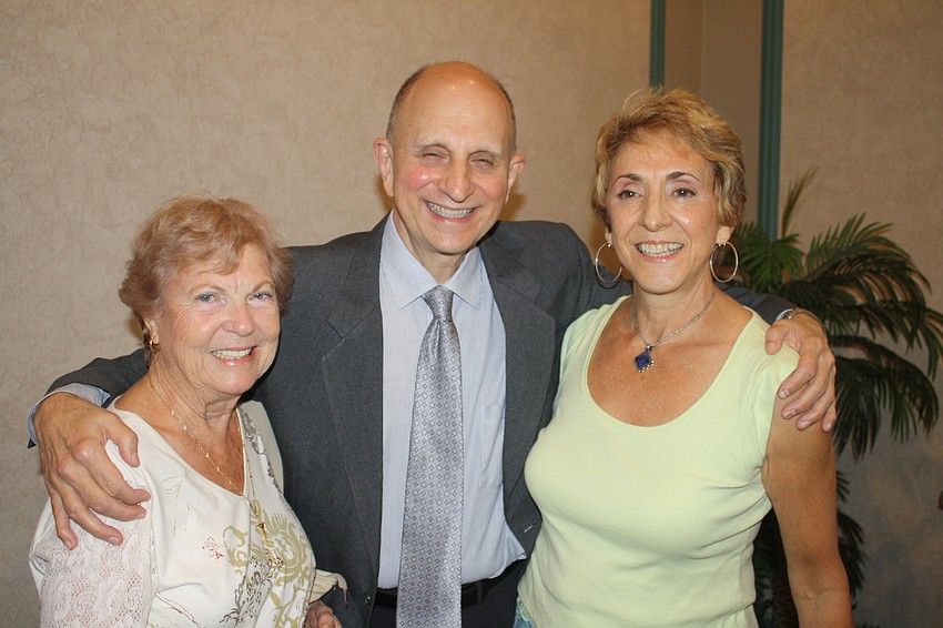 Choir members Jeanine Calleros, Music Director Michael Tucci and Jo Brown