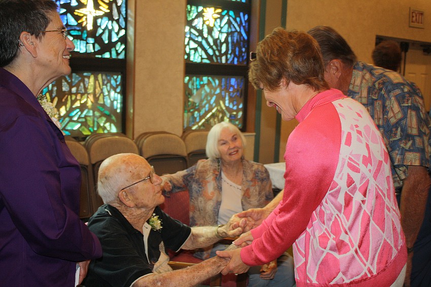 Woody and Sue Wolverton say goodbye to Jim Brown. Woody Wolverton served on the Town Commission with Jim Brown.