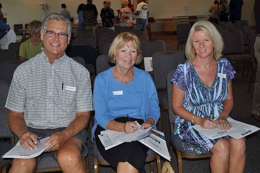 Paul and Deb Swanton and Michelle Bourcy make volunteering a family affair.
