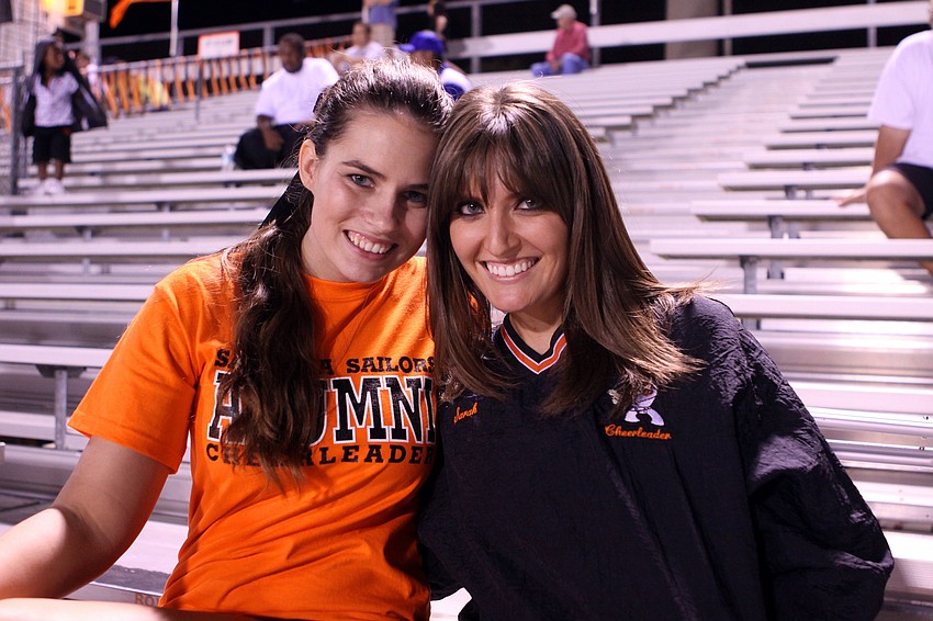 Alums Sarah Medlin and Rachel Livingston watched the homecoming game from the stands.