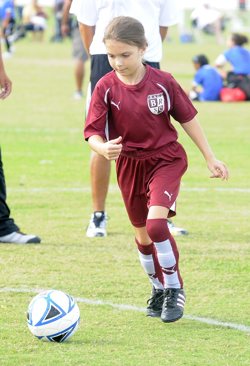 Third-grader Stephanie Bobrek warms up before the start of the Braden River U9 teamâ€™s game against the Florida Revolution Oct. 15.