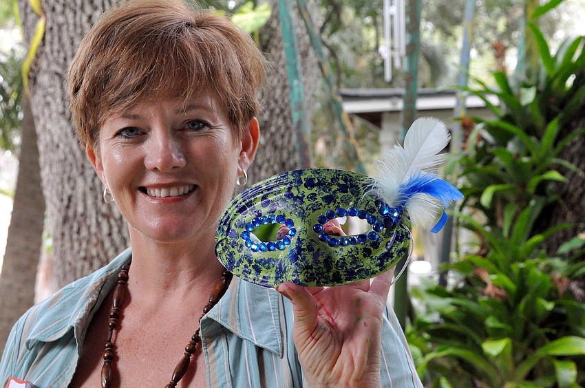 Debi Kleer shows off her mask.