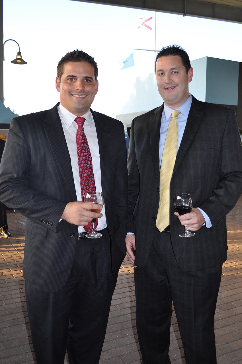 Michael Galliano and Gary Mesko with MetLife, a sponsor of the exhibit