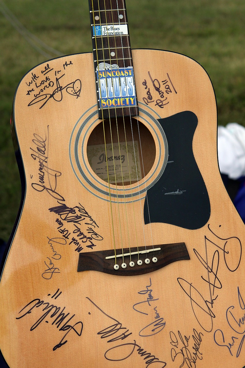 The Suncoast Blues Society raffled off a guitar signed by some major blues artists.