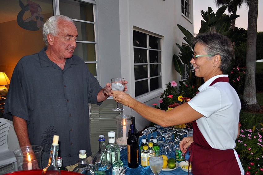 Jonas Ettlinger gets a drink from Sue VanDerVeer