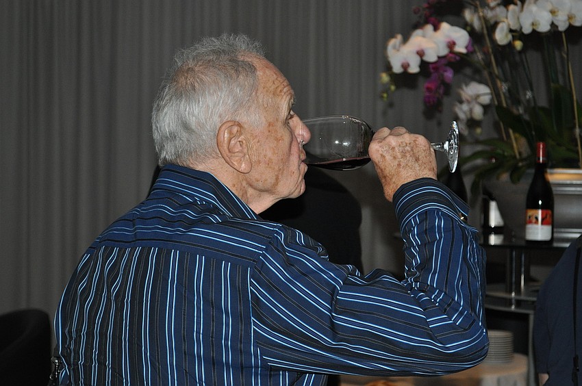 Zbigniew Dziedziech samples his wine.