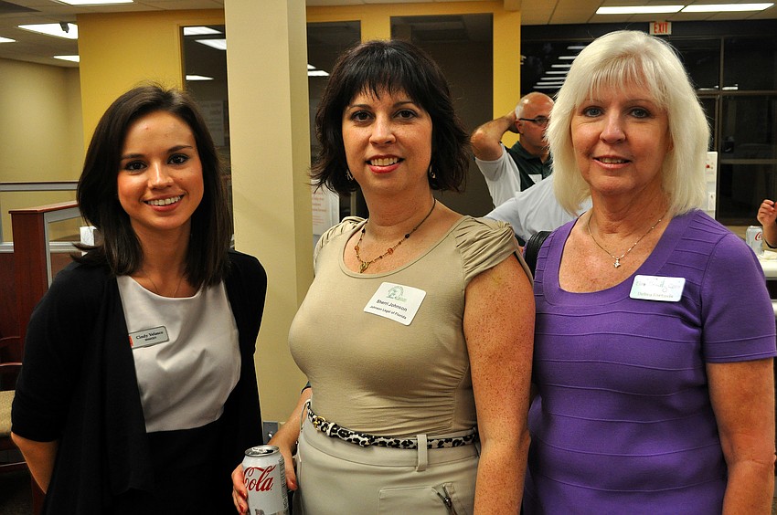 Cindy Velasco, Sherri Johnson and Debra Fortosis pose together Thursday, Nov. 17, at the Chamber's After House and Business Card Exchange at Wells Fargo Bank.