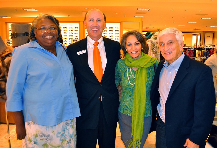 Sandra Terry and Mark Pritchett pose with Rebecca and Rich Bergman, Wednesday, Nov. 30, at Saks Fifth Avenue.