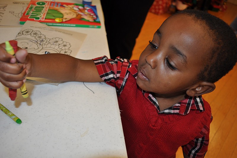 Christian Ford, 2, was eager to create a craft.