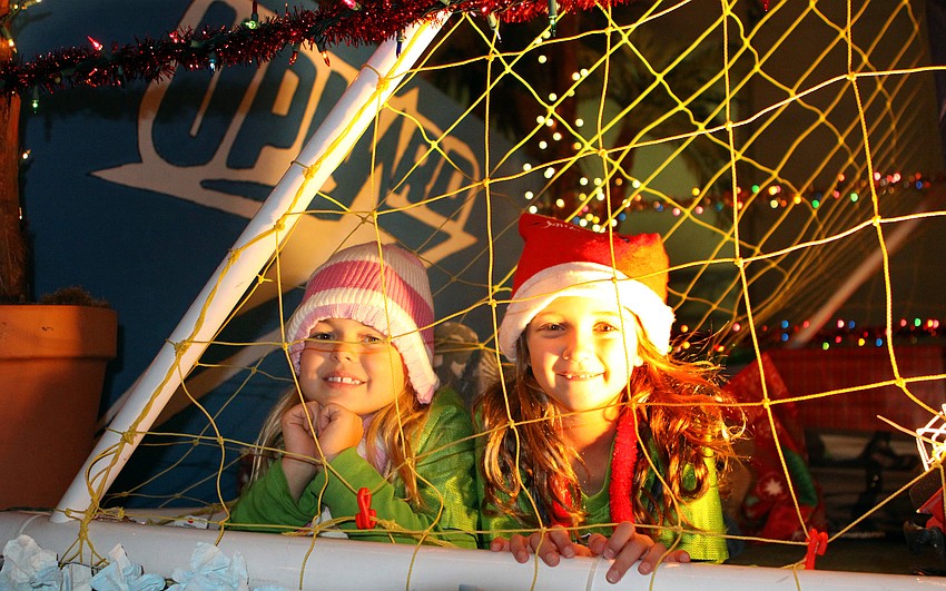 Aubrey Longenecker, 7, an d Keira Burke, 6, posed inside a soccer goal on the Upward float.