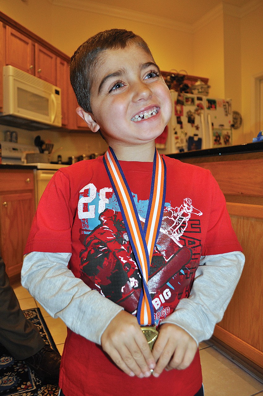 Sabal Harbour resident Nick Tullio completed the 2011 Walt Disney World Half Marathon in honor of his son, Grayson, 7, who was diagnosed with Duchenne muscular dystrophy. Published Jan. 13, 2011.
