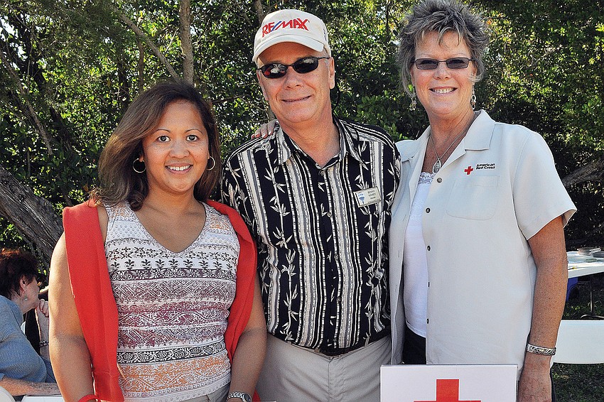 Beverly Arias, Benny Kimsey and Kimberley Reibel worked the Red Cross booth during the Nov. 12 revival of Kimseyâ€™s Bluegrass Picnic fundraisers on Turtle Beach.