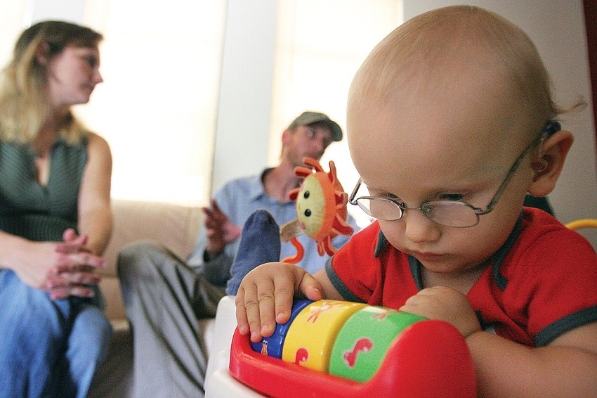 Jaymesun Smith played with one of the many gadgets on his baby walker in June at his home. Smith has a terminal illness called leukodystrophy.