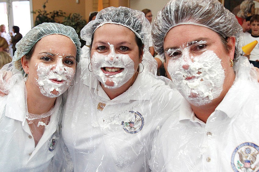 Cindy Hohmann, Sheila Coffey and binky Ravazolli were three of the St. Martha Catholic School who participated in pie-eating contest in November at a pep rally.