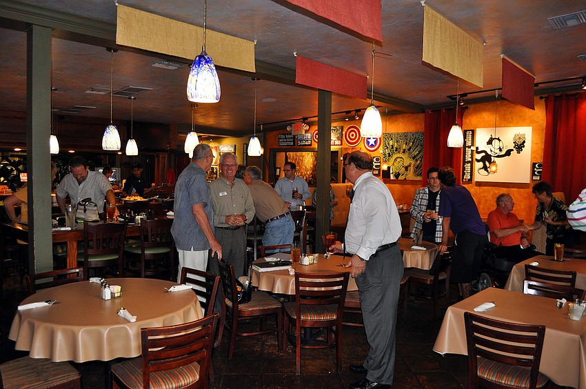 The Young Entrepreneurs of Sarasota chat with one another Tuesday, Sept. 6 at Claytonâ€™s Siesta Grille on Siesta Key.