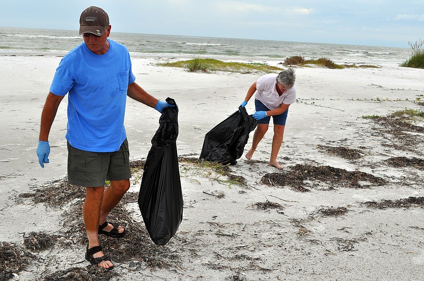 Brian and Lori Patti, while on vacation from AZ, joined the Barefoot Wine Beach Cleanup Thursday, Sept. 8, at Ted Sperling Park.