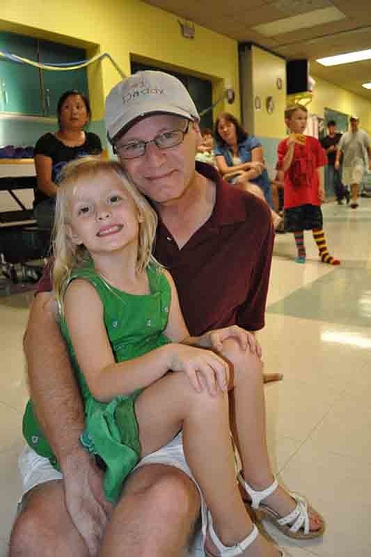 Ashley DeJarnette, 4, watched the contests with her father, Danny.