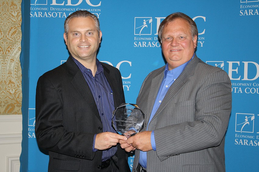 The Innovation Award was presented to CEO Thomas Orsini for Rapid Pathogen Screening. With Orsini is Co-Founder Rob Sambursky. The award was presented by Ray Dowling, Area Manager/External Affairs for Florida Power and light.