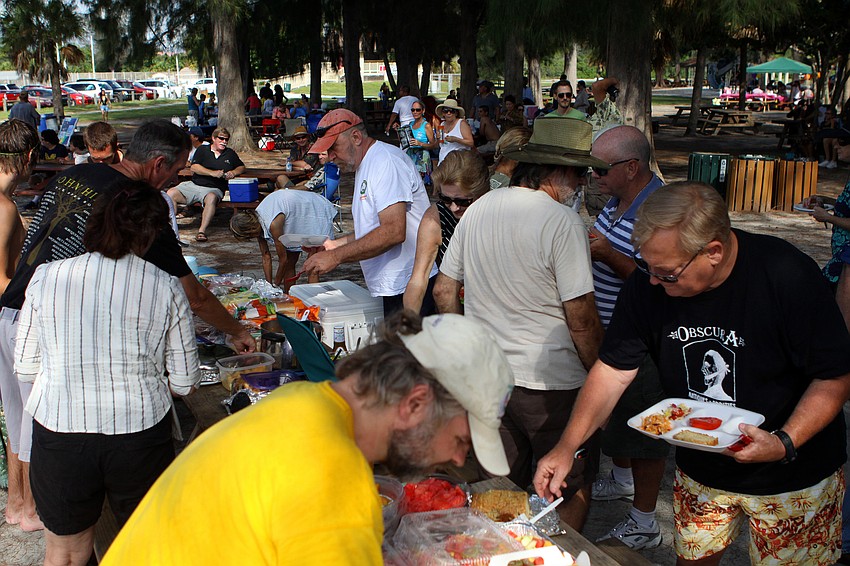 People made their way through the potluck dinner provided by members and friends of WSLR for the 4th Annual Siesta Key Beach Bash Saturday, Sept. 24 at Siesta Key Public Beach.