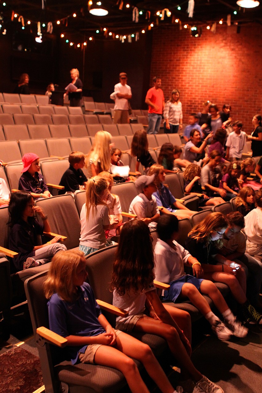 Students from IMG Pendleton and St. Marthaâ€™s School file into their seats.