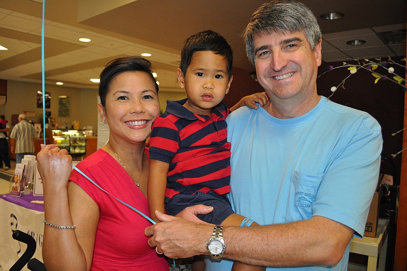 Christine and Mark Holley enjoyed the festivities with their son, Kion, center.