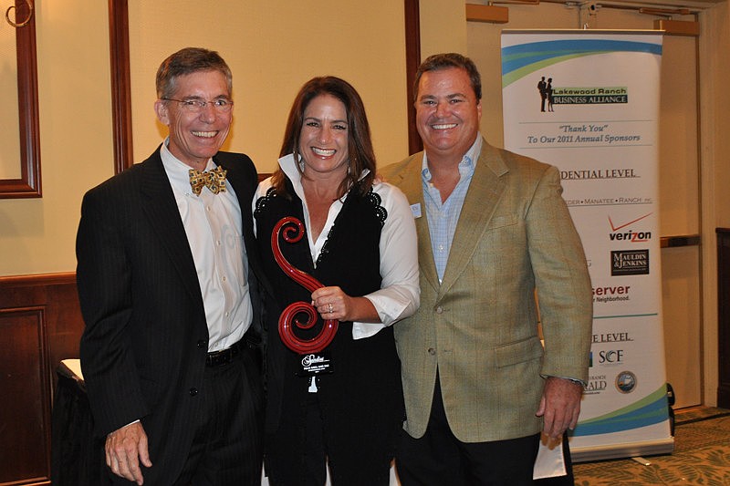 The Observer Group Editor and CEO Matt Walsh with Polo Grill owners Jaymie and Tommy Klauber, winners of the Entrepreneurial Spirit Award