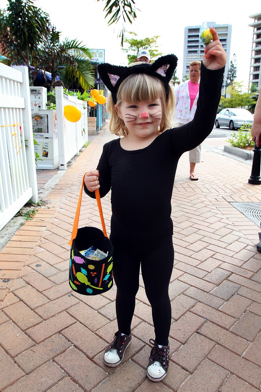 Cassidy Forrar, 3, dressed up as a cat, Monday, Oct. 31, during the Safe Kids trick-or-treating event in Siesta Key Village.